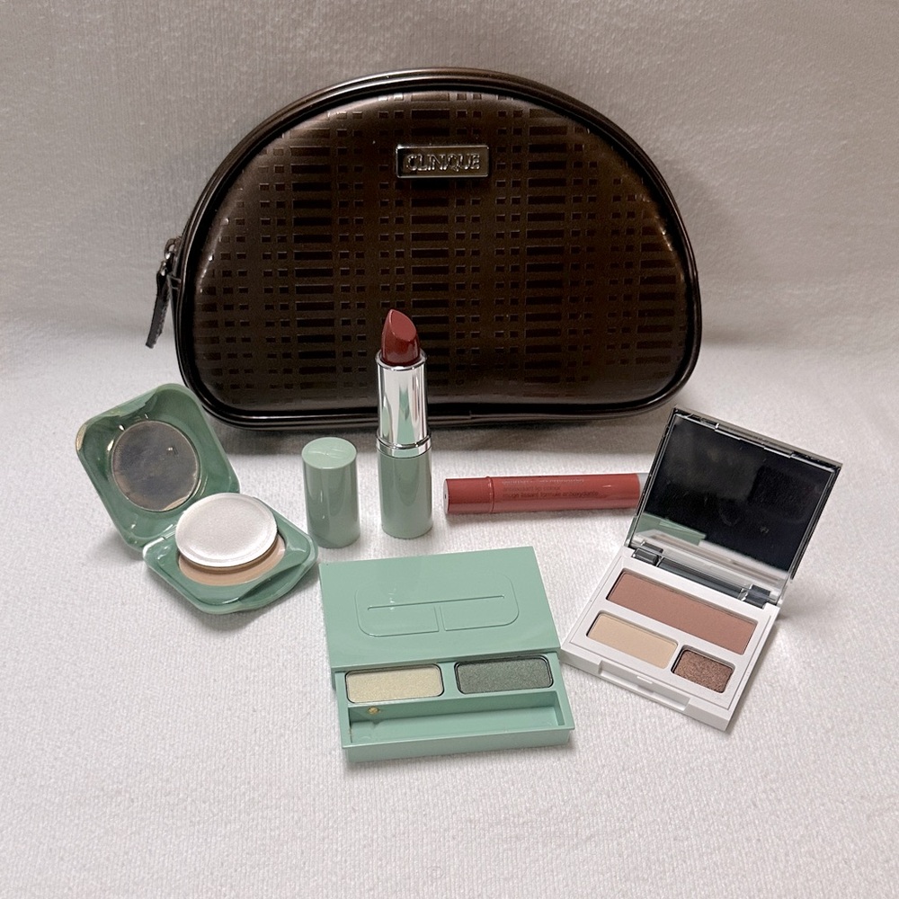 Clinique bag in bronze with lipstick, powder, shadow and vitamin C lip smoothie!
